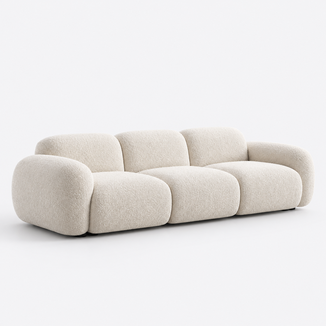 Illustrative ivory sofa in a minimal studio